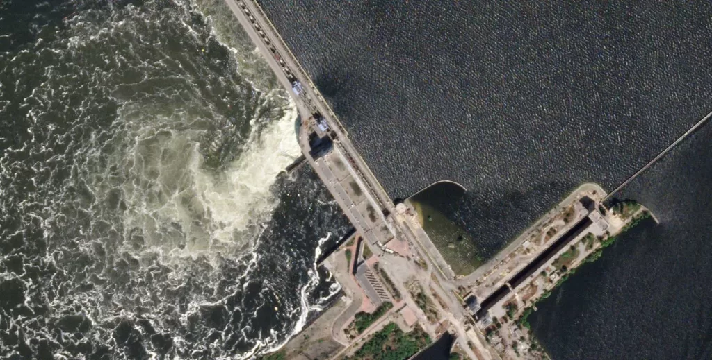 Drone Footage Reveals Ruined Ukrainian Dam and Submerged Villages Amidst Ongoing Conflict